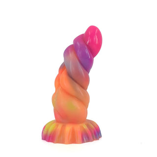 Observe an image of Ribbed Glowing Light Silicone Dragon Dildo with Suction Cup glowing in the dark.