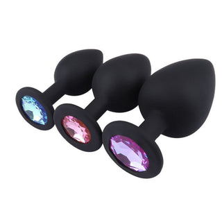 This is an image of Black Silicone Pretty Jeweled Butt Plug 3pcs Anal Training Set featuring three different sizes with bejeweled bases.