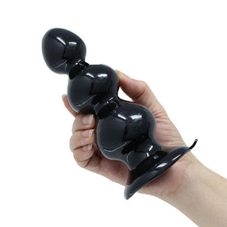 View a glossy black anal toy, made of skin-like silicone material for ultimate pleasure.