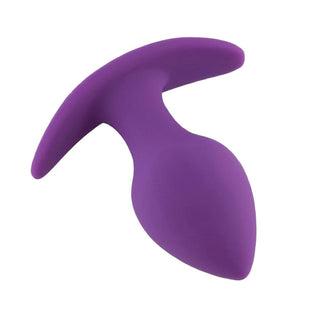 A picture of a compact butt plug in vibrant purple silicone material.