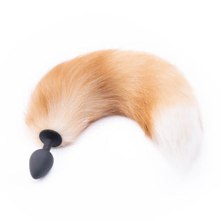 Feast your eyes on an image of 17 Light Brown Fox Tail plug with fluffy light brown and white tail.