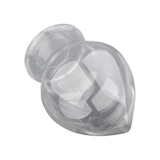 Intimate indulgence with a glass plug designed to reach the P-spot or G-spot for orgasmic bliss.