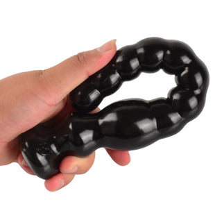 Pictured here is an image of a squishy and flexible long beaded dildo designed for thrilling intimate play.