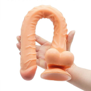 Check out an image of a large dildo with a realistic head for massaging pleasure spots, made to ease its way through internal curves and bends to ignite and gratify lust in the deepest core.