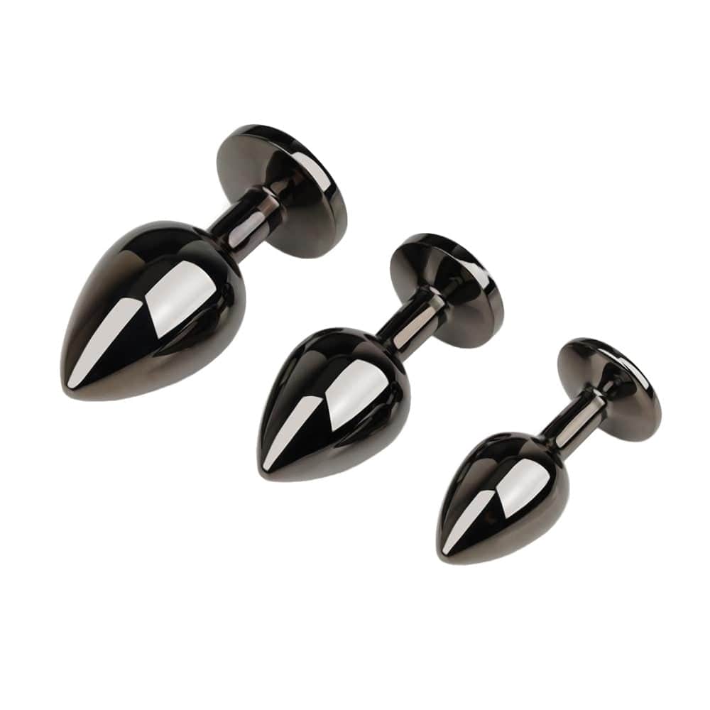 Observe an image of the Gunmetal Cute Rainbow-Colored Jewel Metal 3pcs Anal Training Set plugs, offering a unique and unforgettable visual treat with their radiant jewels and captivating colors.