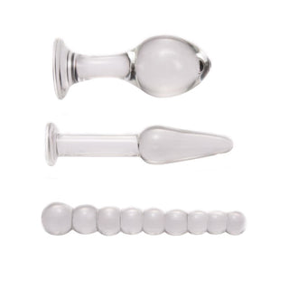 This is an image of 3 Piece Transparent Pyrex Glass Plug Anal Trainer Set For Men, crafted with precision for a symphony of pleasure with lengths and diameters specified.