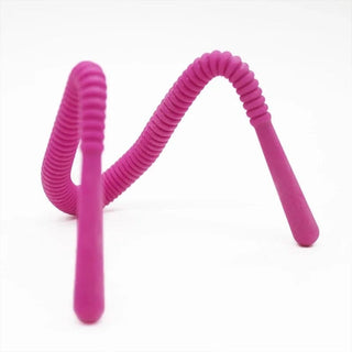 An image showcasing the adjustable string of the Silicone Pussy Spreader, allowing for a secure and snug fit on any thigh size.