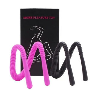 Presenting an image of the Silicone Pussy Spreader in pink color, crafted from silicone and metal for maximum pleasure.