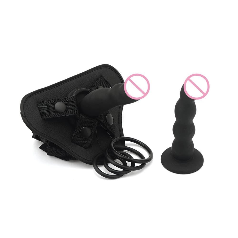 Check out an image of Sensual Play Adjustable Strap On kit with two silicone dildos and various O-rings for versatile pleasure.