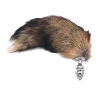 Take a look at an image of Faux Brown Fox Cat Fur Plug with ribbed stainless steel plug and fluffy synthetic fur tail handle.