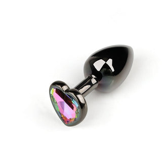 This is an image of polished black metal anal plugs with rainbow jewel embellishments.