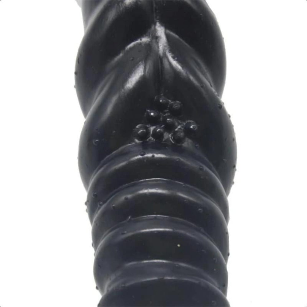 A detailed view of the 2-inch wide Winding Ribbed Stimulator 8 Inch Knot Dildo