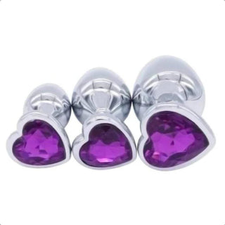In the photograph, you can see an image of Princess Heart-Shaped Crystal Jeweled Anal Training Set Large Toy with radiant heart-shaped jewels.