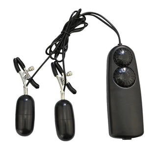 What you see is an image of Sensation Overload Vibrating Clamps in black color with remote control and vibrators.