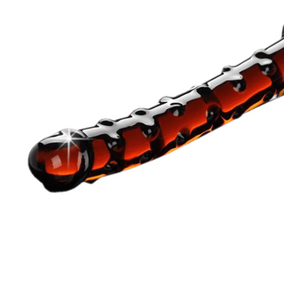 Image of Textured Glass Crystal Large Anal Dildo in sunset orange color with ribbed texture, 7.32 inches long and 0.91 inches wide.