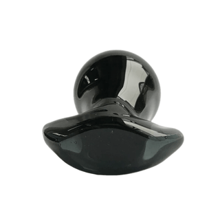 A visually appealing glass plug with a smooth surface for tactile satisfaction.