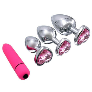 In the photograph, you can see an image of Pink Jewel Heart-Shaped Princess Anal Plug With Vibrator 2.8 to 3.66 Inches Long Training Kit set