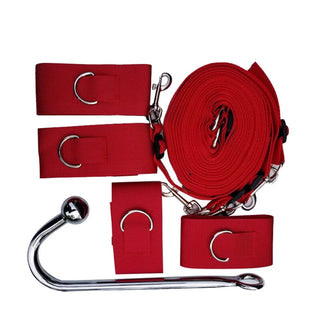 Adjustable under mattress bed restraints in vibrant red color for bondage play.