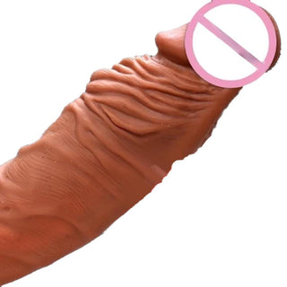 Displaying an image of Get Bigger Realistic Penis Extension Sleeve Thick in skin color and premium silicone material