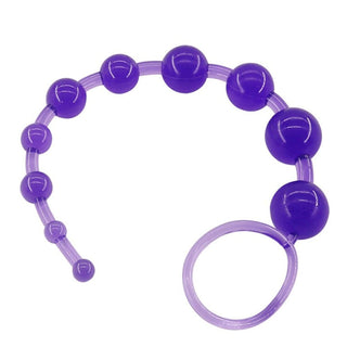 What you see is an image of Beginner-friendly Food Grade Silicone Ball String in royal purple hue with graduated beads for escalating pleasure.