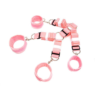 Featuring an image of Adjustable Under Bed Restraint System showcasing pink nylon cuffs for wrists and ankles.