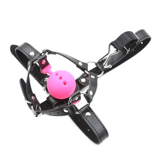 This is an image of Punishment Fetish Wiffle Gag Ball in pink color with breathable silicone gag and textured surface for comfort.