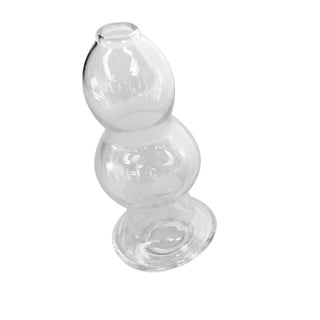 A close-up image of Clear Glass Ass-Gaping Hollow Butt Plug 4.53 Inches Long showcasing its transparent glass design.