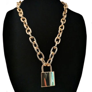 Check out an image of Chain of Slavery Locking Jewellery in gold and silver colors, crafted from stainless steel for durability and dominance.