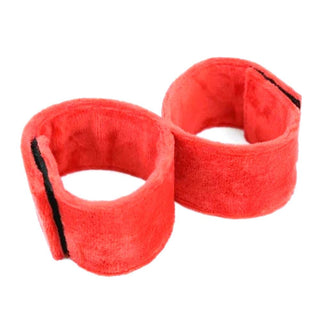 What you see is an image of Super Comfy Red Ankle and Arm Foot Cuffs in plush red material with Velcro adhesives for easy usage.