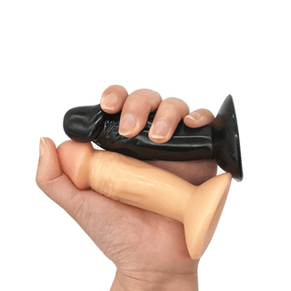A realistic small dildo with a sturdy suction base for hands-free riding and strap-on harness compatibility.
