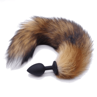 This is an image of Fox Tail Plug Silicone, Brown 17 showcasing a snug fit silicone plug and a visually stimulating fox tail.