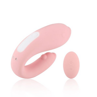 Naughty Dolphin Vibrating Kegel Balls 2pcs Set in pink color made of silicone and ABS plastic with dimensions of 3.93 inches length and 1.18 inches width.