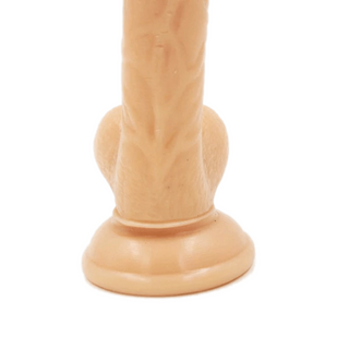 A picture of a silicone dildo designed for pleasure with curves and ridges for ultimate satisfaction.