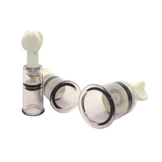 This is an image of ABS plastic Suction Vacuum Toy Nipple Pump with clear and white color combination.