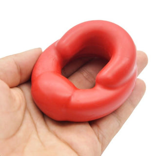 Silicone cock and ball ring in red color with impressive stretchability and snug fit.
