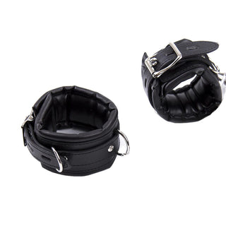 This is an image of Badass Leather Bondage Restraint with Hand Thigh Ankle Cuffs showcasing adjustable belt-type buckles, metal D-rings, and versatile attachment options.