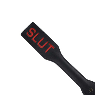 SM Naughty Me Spanking Paddle, measuring 12.6 inches in length and 5.20 inches in width, for precise spanking.