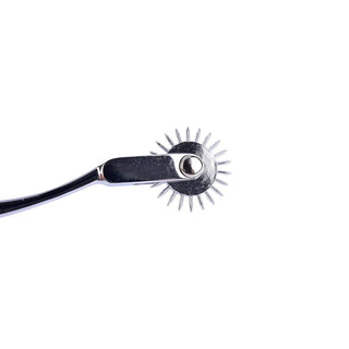 You are looking at an image of the 7.50-inch Handheld Wartenberg Spiky Medical Pinwheel, perfect for enhancing intimate moments.