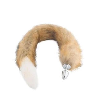 Displaying an image of Stainless Steel Butt Plug With 32-Inch Brown and White Fox Tail, crafted for intense pleasure and wild exploration.