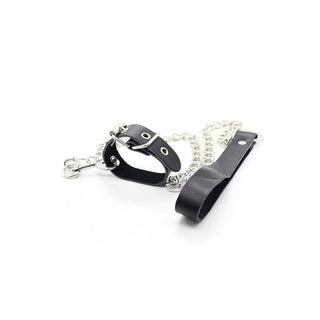 A depiction of Bondage Games Leather Dick Ring Leash in black, crafted from PU leather and metal for a unique sensory experience.