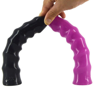 This is an image of a glossy ribbed sex toy with a bulbous head on the tip