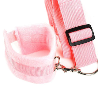Pink nylon Adjustable Under Bed Restraint System offering comfort and durability for intimate play.