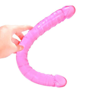 Translucent pink silicone double dildo with U-shaped design for simultaneous anal and vaginal penetration.