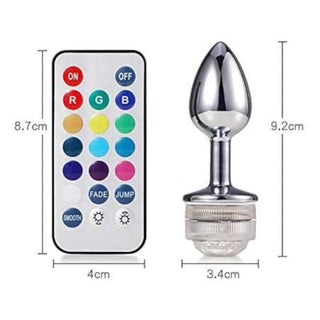 This is an image of Stainless Steel Pretty Jewel LED Plug Men With Remote with package inclusion of a wireless remote control for convenient use.