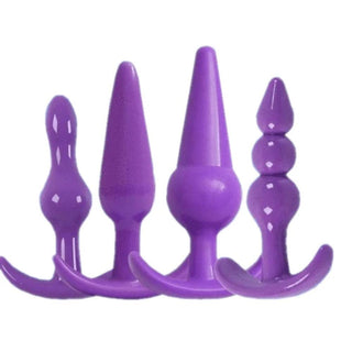 Check out an image of 4 Pcs/Set Various Shapes Silicone Anal Plugs Trainer Kit For Men in black, purple, and pink colors.