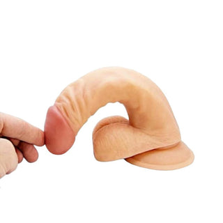 Image of Daily Therapy 7 Inch Real Skin Flexible Dildo with safe play testicles for added stimulation.