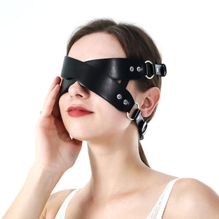 Luxurious faux leather blindfold crafted for safety and comfort during sensual play.