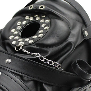 Close-up of Black Leather Mask mouth valve with easy-open latch.