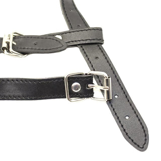 Image showing a metal ring gag harness with adjustable straps for a tailored and comfortable fit during play.