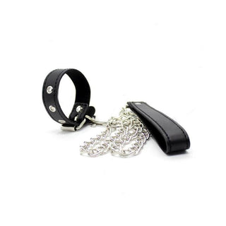 Feast your eyes on an image of Bondage Games Leather Dick Ring Leash, featuring a studded leather ring, detachable metal chain, and leather handle for control and discipline.